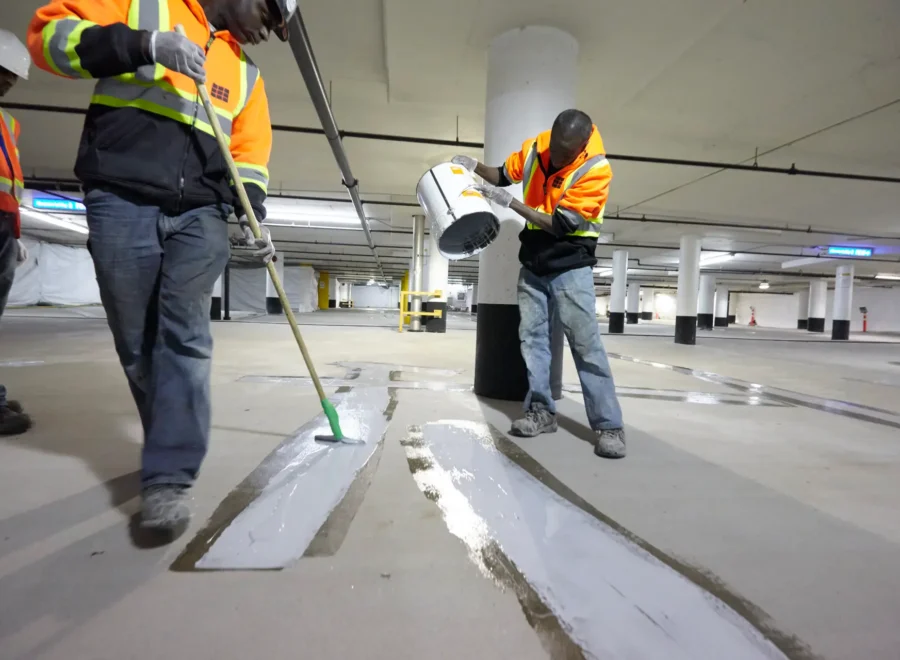 ICC - parking garage workers laying epoxy